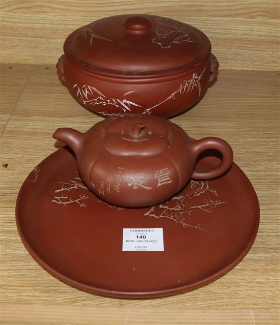 A Yixing pottery covered bowl and stand and a similar teapot